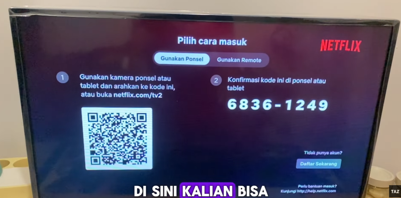 Contoh kode login yang muncul pada layar TV.